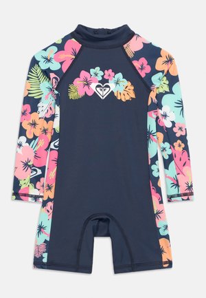 Παιδικό ολόσωμο μαγιό μακριάς μανίκας σε ναυτικό μπλε χρώμα, με πολύχρωμα ροζ, πορτοκαλί και τυρκουάζ λουλουδένια σχέδια στα μανίκια και στο λογότυπο στο στήθος.