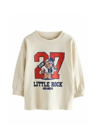 Felpa crema con maniche lunghe e gonfiate. Presenta una grafica colorata di un orso e il testo "27 LITTLE ROCK ARKANSAS" in blu e rosso.