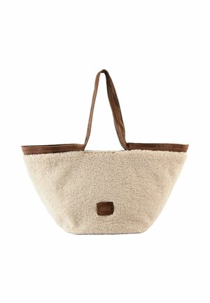 Sac fourre-tout en fausse fourrure beige avec des finitions en cuir marron, double anses et un patch logo carré. Forme arrondie et large pour un grand espace de rangement.