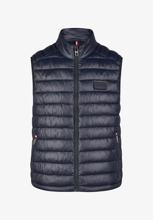 Navy Steppweste mit hohem Kragen, Reißverschluss vorne und horizontalen Nähten. Mit einem Markenetikett und seitlichen Taschen mit kontrastierenden Akzenten.