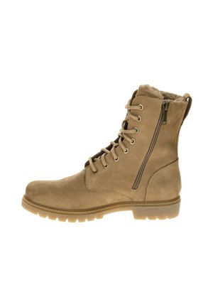Tan suède veterschoenen met een zijrits, bontvoering, stevige rubberen zool en ronde teen. Geschikt voor koudere weersomstandigheden.