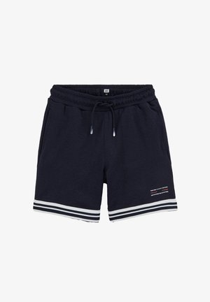 Tengerészkék sportnadrág elasztikus derékpánttal, húzózsinórral, oldalzsebekkel, fehér csíkozású szegéllyel és kis nyomtatott szöveggel a bal lábszáron.