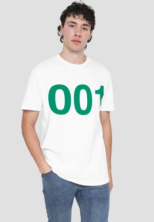 White cotton t-shirt with green oversized number "001" printed on the front. Short sleeves and crew neckline. Casual fit with a smooth texture.