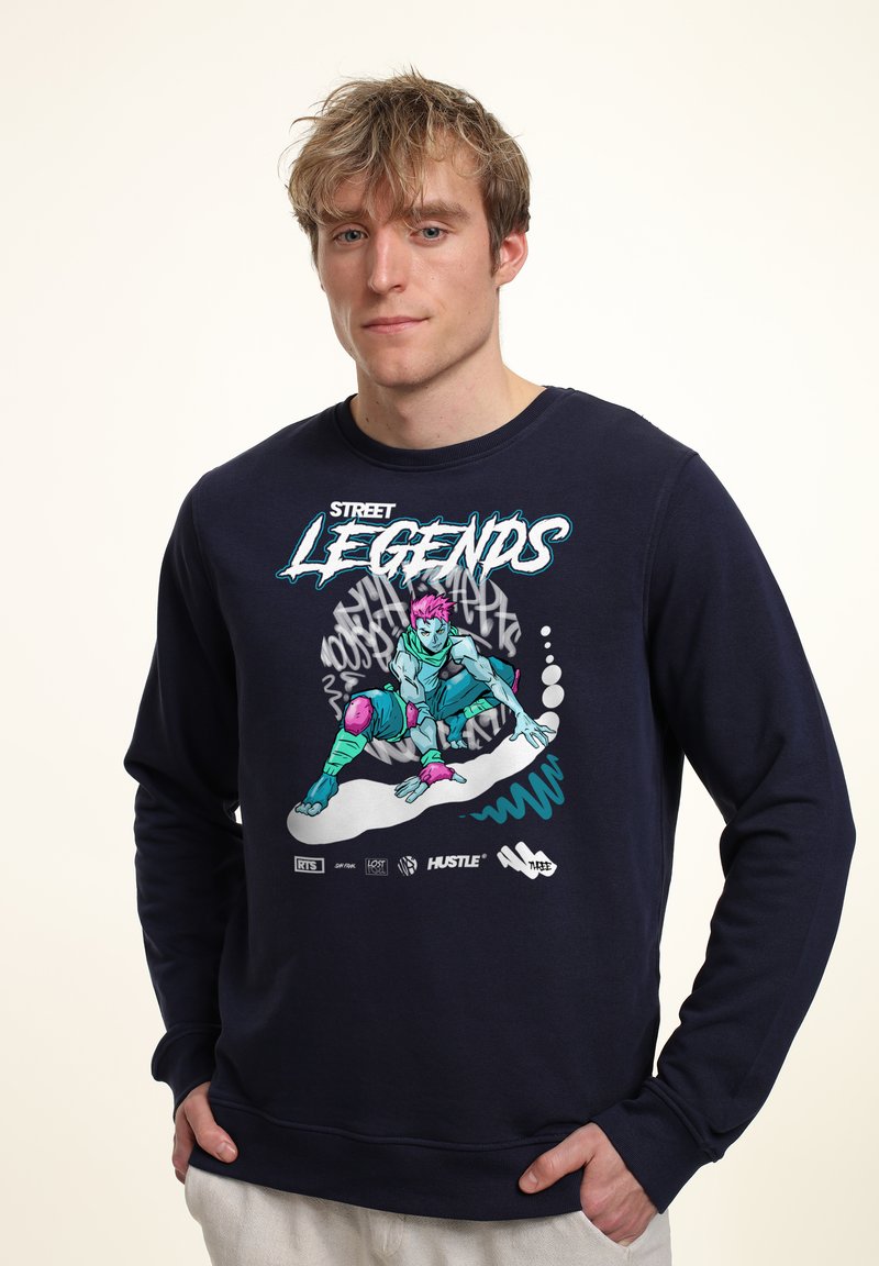 Felpa blu navy con una stampa grafica di un personaggio dai colori vivaci, con una vestibilità rilassata e polsini a costine.