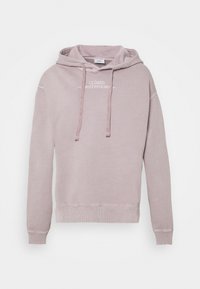 Světle růžová mikina s kapucí vyrobená z měkké bavlny. Má klokaní kapsu, nastavitelnou kapuci se šňůrkou a žebrované manžety a lem. Na přední straně je vyšívaný text.