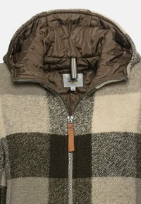 Wollmischung Zip-Jacke mit einem beigen und braunen Karomuster, ausgestattet mit einem gesteppten braunen Futter und einem mit Leder akzentuierten Reißverschlusszug.