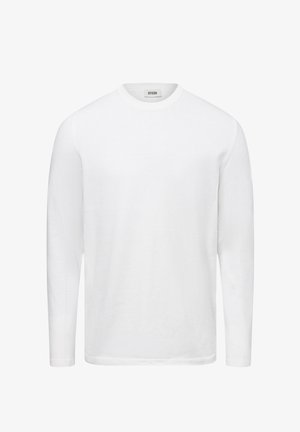 Weißer, langärmeliger Rundhalspullover mit einem Etikett im Kragen, das "DRYKORN" liest, vor einem einfachen Hintergrund präsentiert.