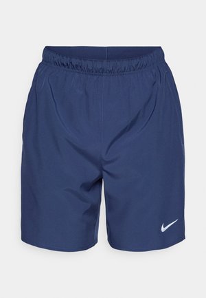 Ναυτικό μπλε αθλητικές βερμούδες με ελαστική μέση, ομαλή υφή και λευκό λογότυπο Nike στο κάτω δεξί μέρος.