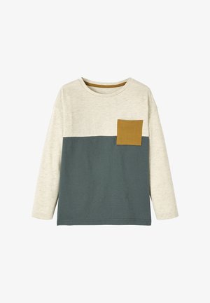 Long-sleeve color-block shirt with cream top, dark gray bottom, and mustard yellow chest pocket on a white background.