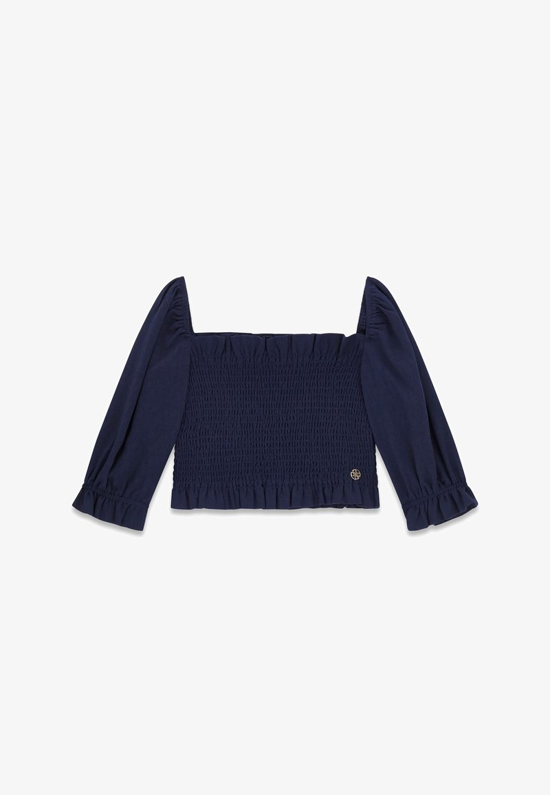 Crop top à manches longues bleu marine avec corsage froncé, encolure carrée, manches bouffantes et poignets à volants, doté d'un petit logo métallique rond.