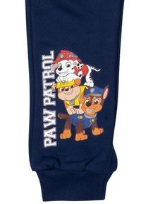 Marineblaue Jogginghosen mit einem grafischen Druck von drei Comic-Hunden und dem Text "PAW PATROL", die lebendige Farben und verspielte Designs zeigen.