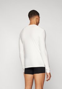 O'Neill ESSENTIALS SKINS - Aizsargveste - snow white