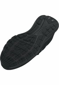 Semelle de chaussure de sport noire avec caoutchouc texturé, présentant des motifs de traction multidirectionnels et un bord légèrement courbé pour le soutien.