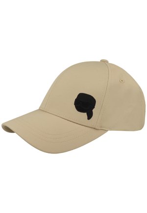 Beige baseballpet met gebogen klep en een kleine zwarte geborduurde gezicht met een zonnebril en een bandana op het voorpaneel.