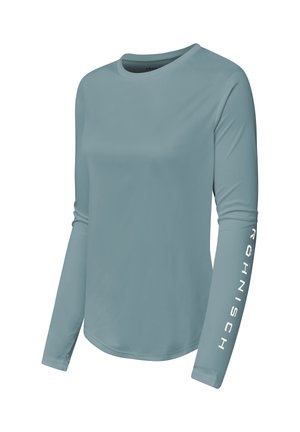 Camicia a maniche lunghe, azzurro chiaro, realizzata in tessuto liscio. Presenta uno scollo rotondo e un testo bianco sulla manica destra.