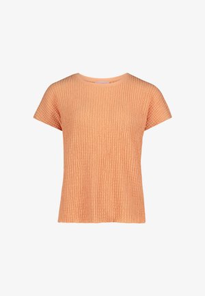 Haut en tricot texturé de couleur pêche à manches courtes, avec un col rond et un ourlet droit sur fond blanc.