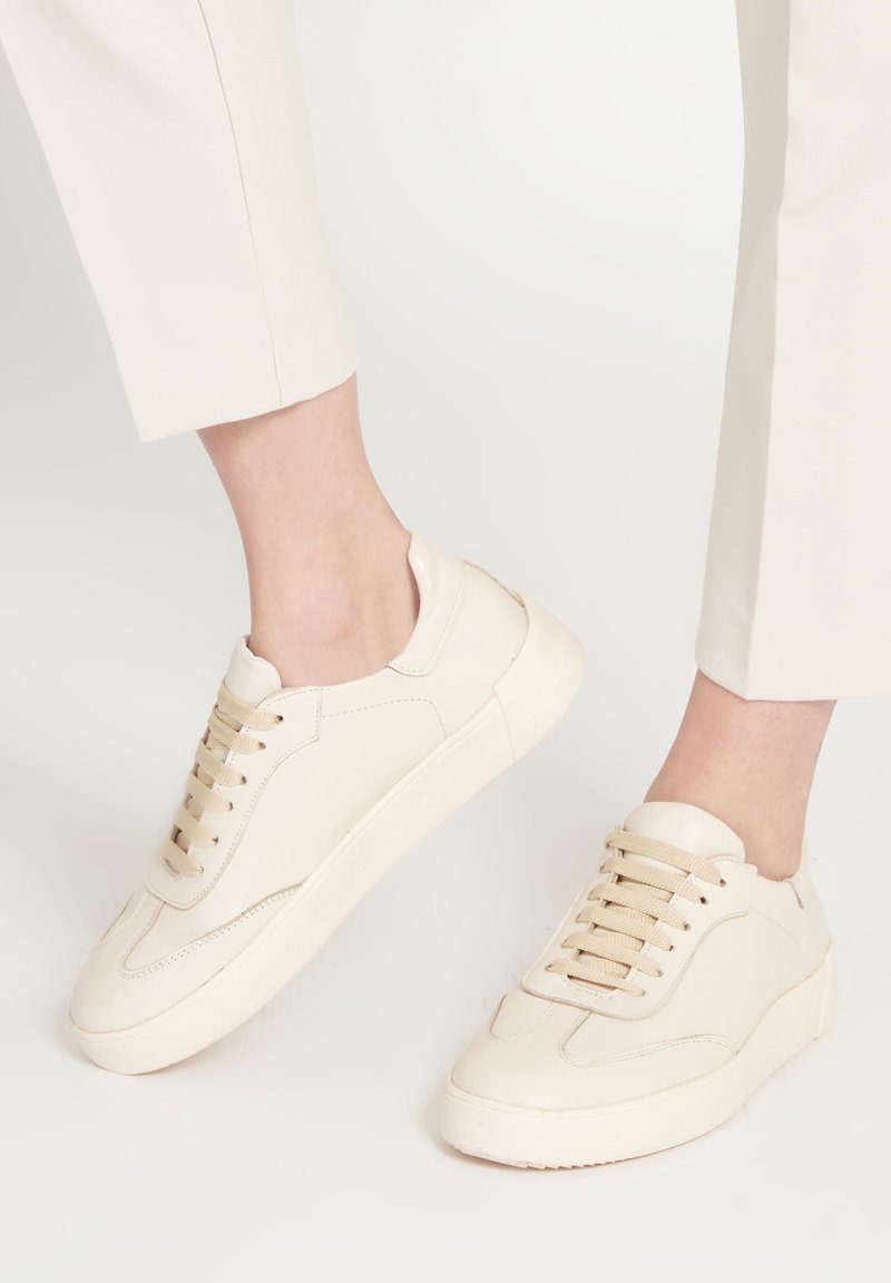 nude designer trainers