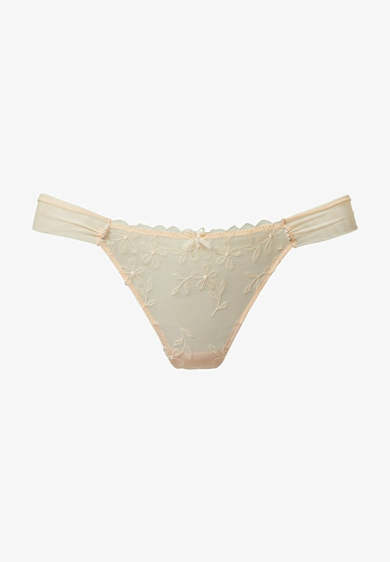 Lace-trimmed string in zacht beige materiaal, met delicate bloemenborduursels en een klein strikje in het midden voor.