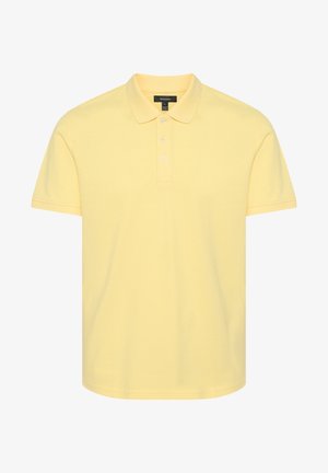 Kollane polo särk, mis on valmistatud puuvillast, klassikalise krae, kolme nööbiga kinnituse, lühikeste varrukate ja sirge äärega.