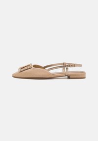 Beige slingback flats with a pointed toe, textured fabric, and gold-tone embellishment on the vamp. Flat heel and adjustable strap.