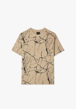 Maglietta beige a maniche corte con motivo a crepe nero, collo rotondo e finitura tessile morbida. Nessuna minuteria o accenti visibili.