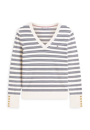 Roomkleurige, lange mouw V-hals trui met dunne marineblauwe horizontale strepen, klein logo op de borst en gouden knopen aan de manchetten.