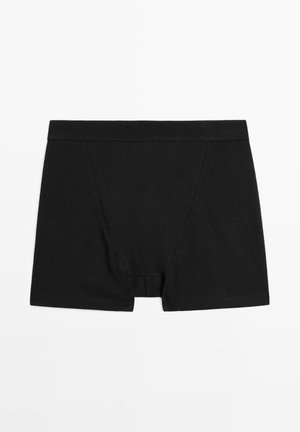 Černé bavlněné boxerky s měkkým elastickým pasem, nabízející těsný střih, ploché švy a čistý design bez vzorů.