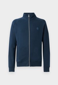 Hanorac bleumarin cu fermoar, cu guler înalt, manșete și tiv din tricot; are un mic logo brodat pe piept. Textură a fabricii netedă.
