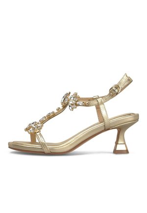 Sandalo oro con tacco alto, cinturino alla caviglia e fibbia, decorato con pietre trasparenti lungo il cinturino a T.