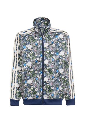 Veste zippée florale avec une base marine ornée de motifs de fleurs blanches et bleues, des poignets côtelés et trois rayures blanches sur chaque manche.