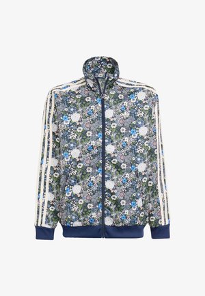 Blomstret jakke med lynlås i marineblå, prydet med hvide og blå blomster mønstre, ribbede cuffs og tre hvide striber på hver ærme.