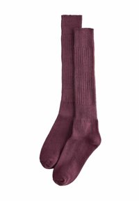 Knie-hoge sokken in een diepe bordeauxkleur met een geribde textuur. Gemaakt van zachte materialen, met versterkte teen- en hielgebieden.