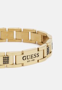Guess FLAT CHAIN UNISEX - Zapestnica - yellow gold-coloured/black