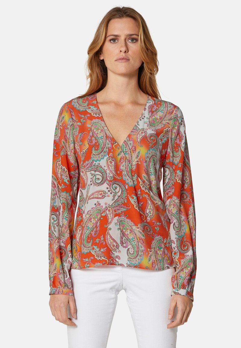 Langärmlige Bluse in Orange mit Paisleymuster in Pink und Grün. Mit tiefem V-Ausschnitt und weichem, glattem Stoff.