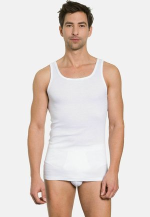 White cotton tank top with wide straps and a fitted design, worn by a male model. Smooth texture, simple style, no patterns or accents.