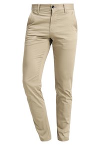 Béžové lehké kalhoty s úzkým střihem, hladkou texturou, poutky na pásek a jedním knoflíkem na zapínání v pase.