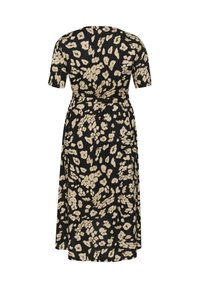 Vestido negro con mangas cortas, con un patrón floral beige. Diseño fluido con una cintura ceñida y dobladillo a la altura de la rodilla. Textura de tela suave.