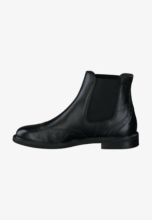 Zwarte leren Chelsea-boot met elastische zijpanelen, brogue-details op de neus en een gladde afwerking. Platte rubberen zool.