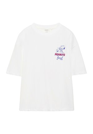 White short-sleeve t-shirt with small graphic of Snoopy and Woodstock above red and blue "Peanuts Social Club" text on chest.