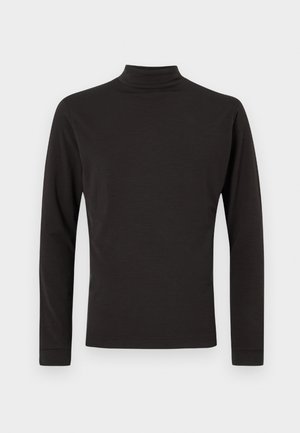 Črna dolga rokav turtleneck majica iz mehkega materiala, z oprijetim krojem in gladko teksturo, brez vidnih vzorcev ali dodatkov.