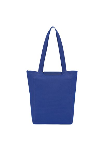 Blue canvas tote bag with wide, flat straps and a rectangular shape. Features a simple design and a sturdy fabric texture.
