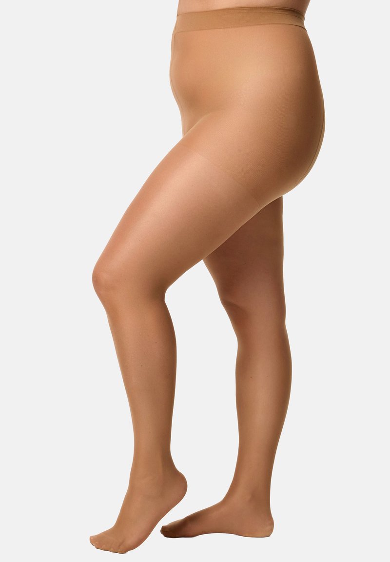 Media transparent de color nude con una textura suave y una cinturilla elástica. Diseñadas para cubrir las piernas sin refuerzo en la puntera para un aspecto sin costuras.