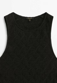 Haut noir sans manches avec motif floral texturé subtil et encolure ronde, taille petite, fabriqué en Turquie.