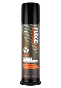 Conteneur cylindrique noir avec une finition mate, présentant des textes et motifs en argent et orange. Contient 85 g d'argile coiffante pour une tenue maximale.