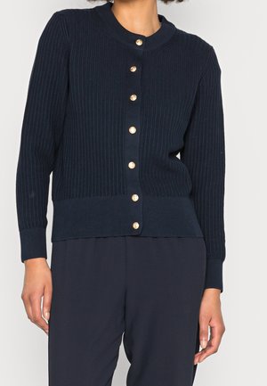 Navy geribbelde cardigan van gebreide stof, met een ronde halslijn, gouden knopen aan de voorkant en aansluitende manchetten bij de mouwen.