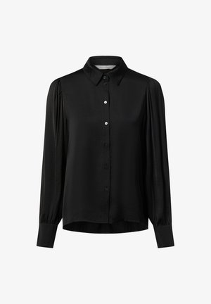 Blouse noire à manches longues avec fermeture boutonnée sur le devant, col pointu, épaules légèrement bouffantes et larges poignets.