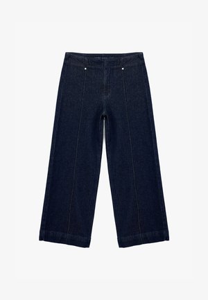 Ciemnoniebieskie spodnie z szerokimi nogawkami i wysokim stanem. Posiadają kieszenie z przodu, stonowane przeszycia i czysty wykończenie. Gładka tekstura i uporządkowany krój.