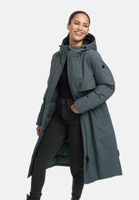Long, teal puffer coat with a hood, featuring a snap closure and adjustable drawstring waist. Black accents on cuffs and pocket.