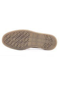 Semelle de chaussure en caoutchouc avec un motif texturé et antidérapant. La couleur est brun clair avec des rainures et des formes pour une meilleure adhérence. Design de base propre et plat.