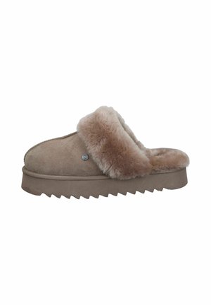 Beige suede slippers with a fluffy cream fur trim, rounded front, and a textured, chunky sole. Accented with a small logo detail.